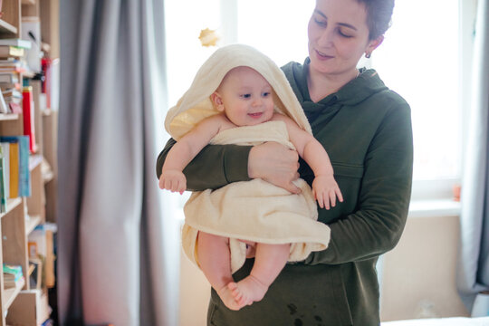 Mother and child after daily bathing routine