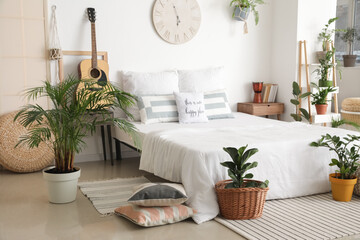 Interior of stylish bedroom with plants © Pixel-Shot