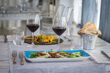 Sliced beef simmenthal aged 40 days with rocket and parmesan with demi glace sauce.
 Tagliata di manzo razza simmenthal frollata 40 giorni rucola e grana con salsa demi glace