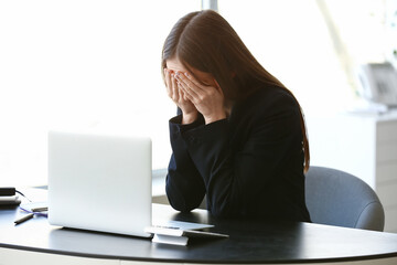 Crying young woman in office. Concept of harassment
