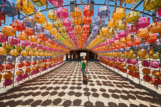 Woman admires lanterns at Naksansa Temple / Korea