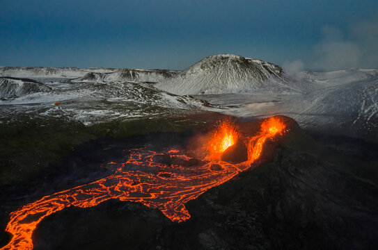 Volcano erupting with hot orange lava