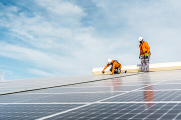 Unrecognizable solar panel technicians working in Spanish installation