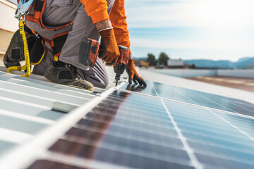 Unrecognizable solar panel technician working in Spanish installation