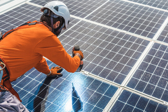 Unrecognizable solar panel technician working in Spanish installation