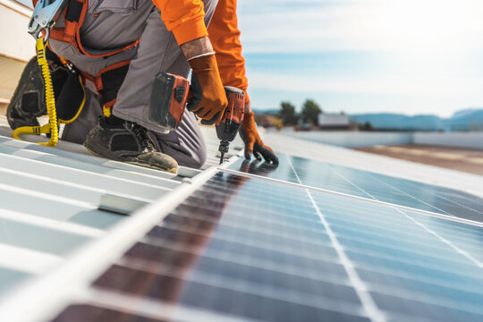 Unrecognizable solar panel technician working in Spanish installation
