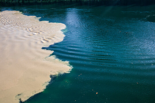 Confluence of a pristine clean and muddy dirty river in B.C. Canada.