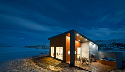 illuminated holiday home in Iceland during the winter