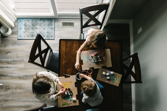 Homeschool art projects at the kitchen table fish and paint