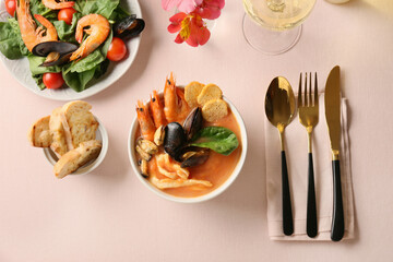 Fototapeta na wymiar Bowl with tasty Cacciucco soup on table