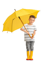 Cute little boy with umbrella on light background