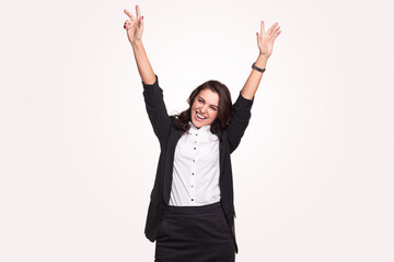 Happy businesswoman with arms raised