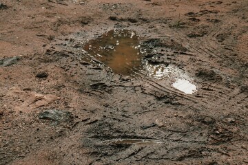 Wheel tracks on the soil road background or texture