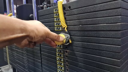 Adjustable the required weight for a workout, weights for a machine in the gym, bodybuilding and...