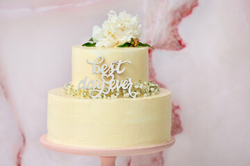 Stand with delicious wedding cake and text BEST DAY EVER on color background, closeup