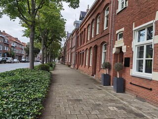Typical street facade in Netherlands with brick houses