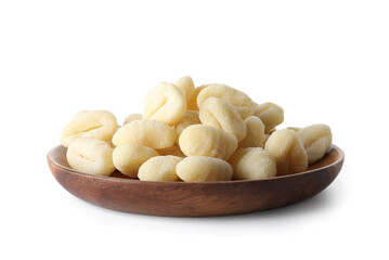 Plate with raw gnocchi on white background