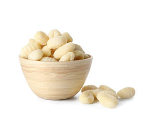 Bowl with raw gnocchi on white background