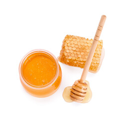 Jar of honey, comb and dipper on white background