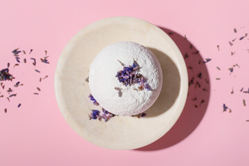 Fototapeta na wymiar Composition with lavender bath bomb on color background