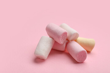 Sweet marshmallows on pink background