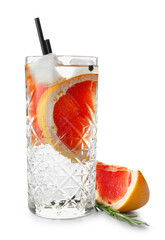 Glass of cold gin tonic with grapefruit slices on white background