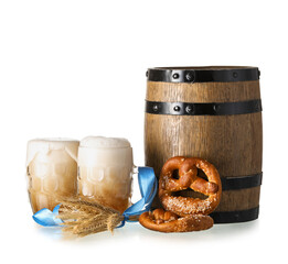 Mugs of fresh beer, pretzels and wooden barrel on white background. Oktoberfest celebration