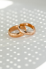 wedding rings. Golden ring shadow. 