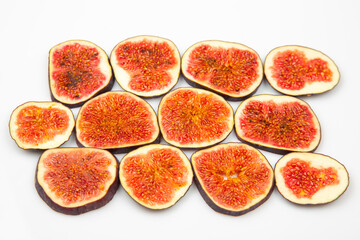 fresh figs cut into braids on a white background. vitamin organic healthy food