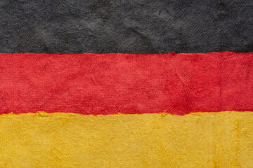 paper abstract in colors of Germany national flag - black, red and gold, set of textured, handmade, bark paper sheets