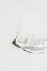 Transparent cosmetic gel on the white background.