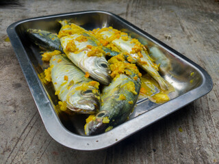 Fish that has been seasoned and ready to be grilled