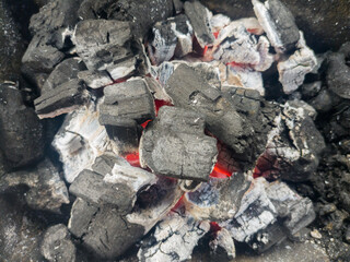 wood charcoal that has been read and is ready to be used for grilling fish, chicken, beef