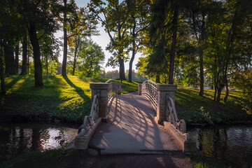 View of the cast-iron openwork bridge across the water maze channel near the White Lake in the...
