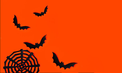 Orange background with black bats and cobwebs - Background for Halloween. Place for text, banner.