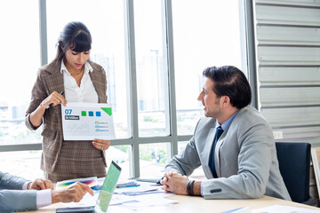 Businesspeople discussing together in the conference room during meeting at the office.