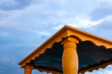 Looking up view of the top of a beachfront boardwalk gazebo. 