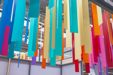 Palette with shades of colors for tinting paint on the counter in the store