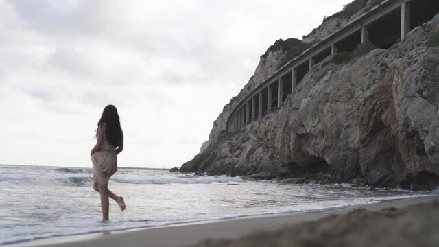 Latino model spending time in solace at Platja de Gava Barcelona
