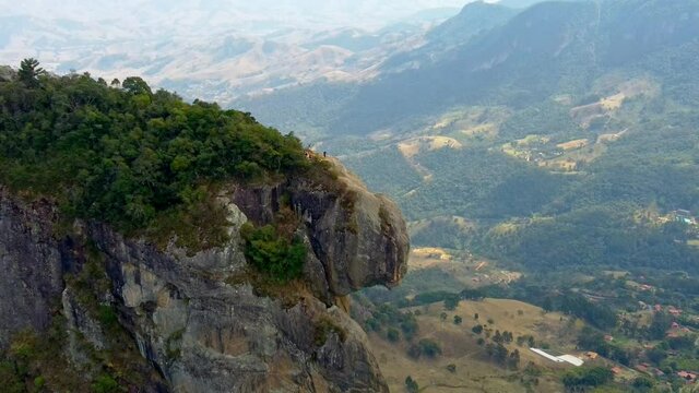 Fast dolly in over Rock Climbing Team on the summit of Pedra Do Bau in The Mantiqueira Mosaic in Brazil.