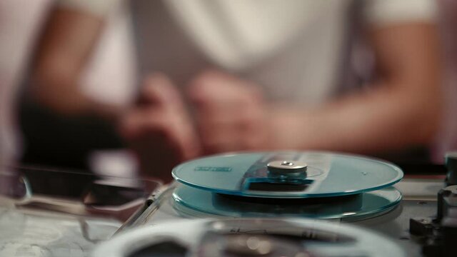 Crime investigation, talking witness recording evidence on tape recorder, closeup shot