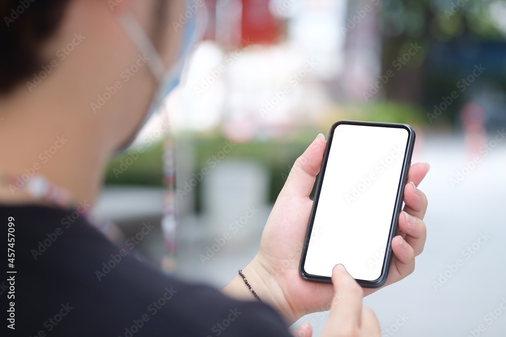 Poster close up view female holding mock up mobile phone with blank screen..