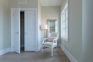 Bright Room with Chair Mirror and Floor Lamp open closet door