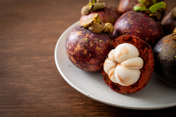 fresh mangosteen on white plate