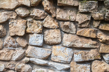 Backgrounds of the old fortress wall. Background of vintage stone wall