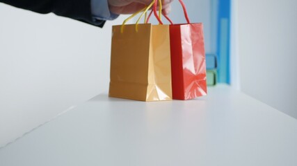 Presents for a Birthday in a Gift Shop. Colored Paper Bags with Anniversary Gifts.