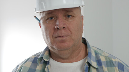 Portrait with a Disappointed Nervous and Upset Engineer Wearing Helmet.
