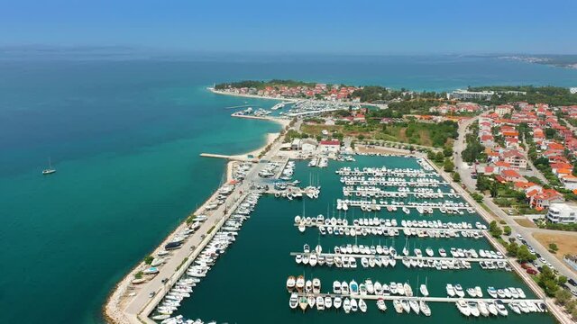 Zadar, Croatia - 4K flying over yacht marina of Zadar  on a bright summer day with blue sky and turquoise sea water