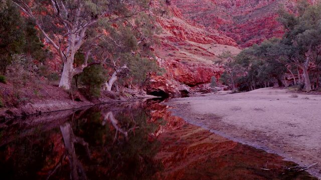 a sunrise zoom in shot of in ormiston gorge in tjoritja / west macdonnell national park of the northern territory, australia