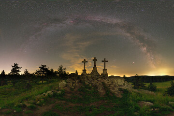 Milky way in summer over three crosses